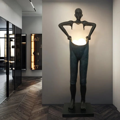 Man Carrying Pants Statue Floor Lamp