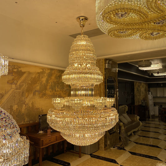 chandelier,chaandeliers,pendant,crystal,metal,gold,luxury,empire,ceiling,tiers,layers,multi-tier,extra large,oversized,large,huge,big,living room,dining room,high-ceiling room,foyer,stairs,hallway,entryance,hotel lobby,duplex hall,loft