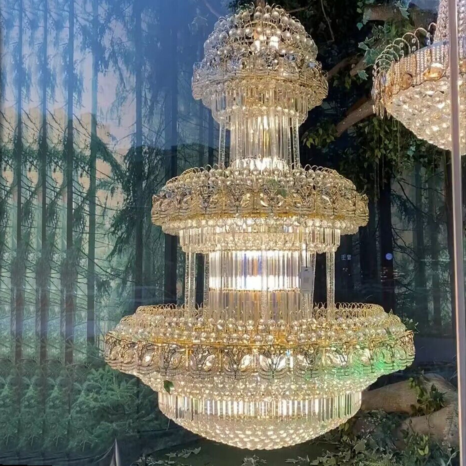 chandelier,chaandeliers,pendant,crystal,metal,gold,luxury,empire,ceiling,tiers,layers,multi-tier,extra large,oversized,large,huge,big,living room,dining room,high-ceiling room,foyer,stairs,hallway,entryance,hotel lobby,duplex hall,loft 